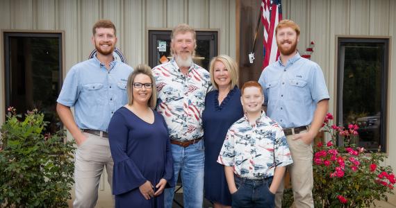 Rebel Services Family smiling together